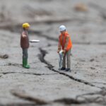 3 men in white and orange shirts and green pants action figures